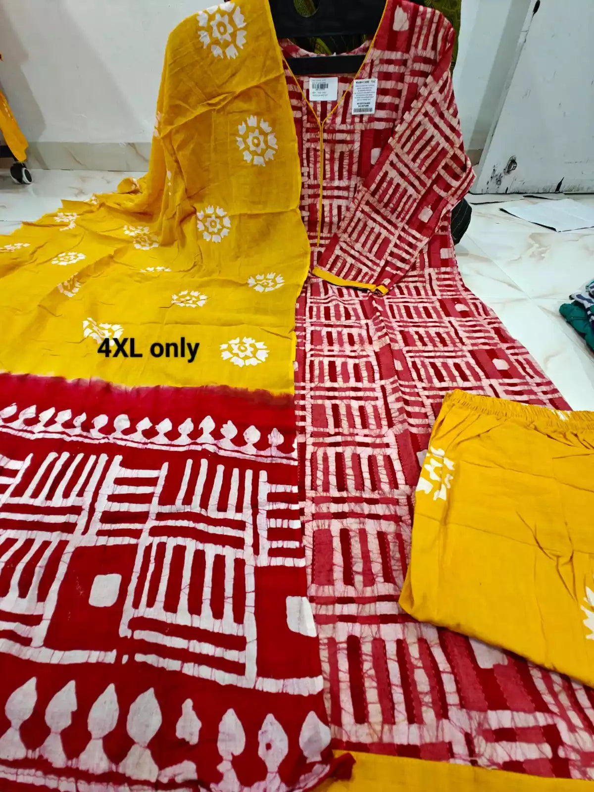 4xl cotton batik suit with dupatta featuring vibrant batik prints and hand embroidery.