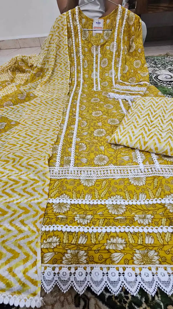 A traditional yellow and white dress with Karachi pattern, pleats work, neck potli buttons, cotton print sleeves, and Karachi lace trim. Comes with a matching mal dupatta featuring similar designs and a cotton pant.