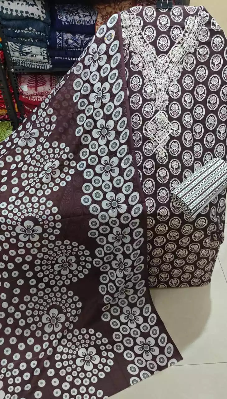 brown floral unstitched cotton suit with lace embroidery displayed on a mannequin.