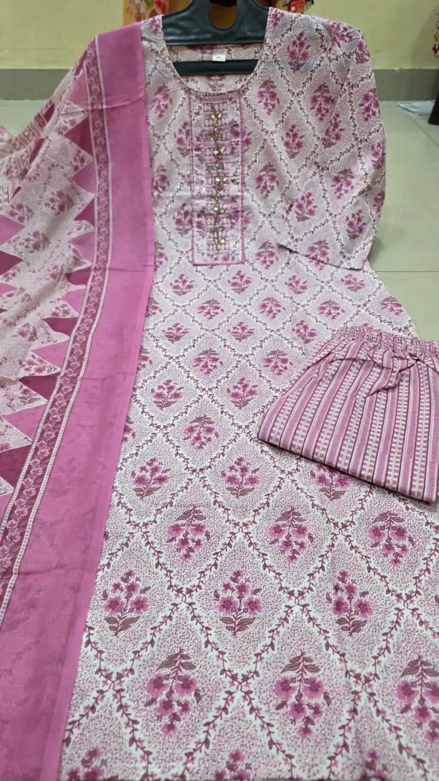 Onion pink floral print soft cotton suit featuring a detailed embroidered neck patch.