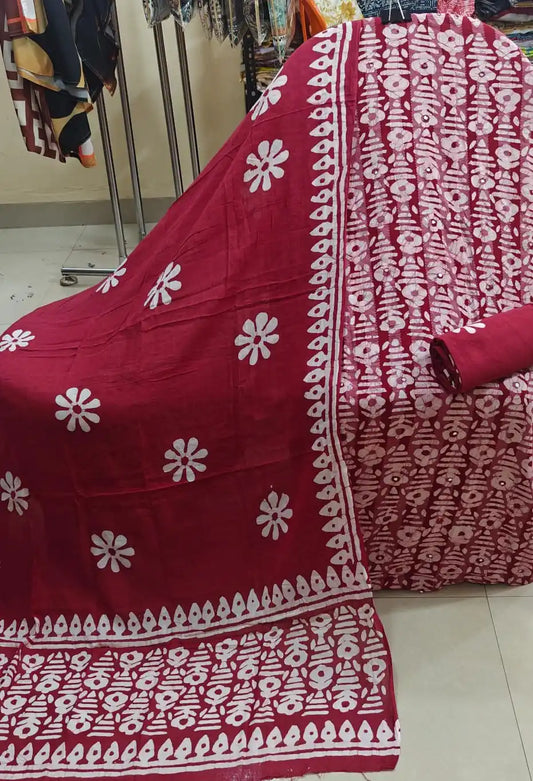 Maroon red unstitched cotton dress material with traditional white batik print layout alongside a matching dupatta showcasing floral patterns and detailed borders by ASC.