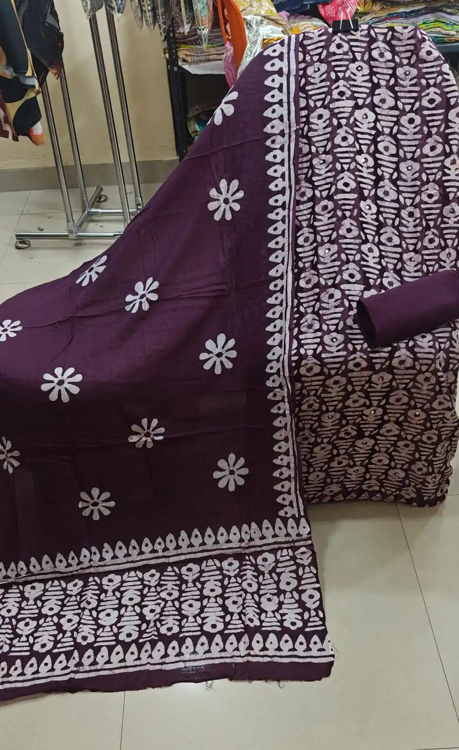 Deep wine purple unstitched cotton suit fabric with all-over geometric batik print and a premium cotton dupatta detailed with bold white flower motifs by ASC.