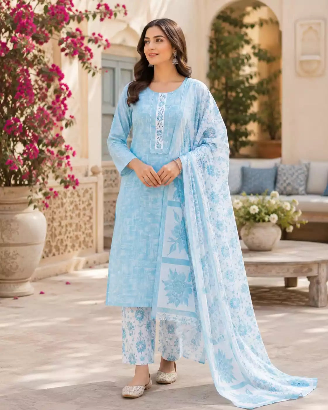 Sky blue cotton pant set featuring a straight cut top, printed dupatta, and stylish pants.