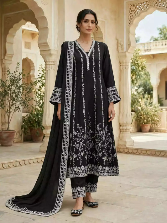 Woman wearing black flared Anarkali suit with ivory embroidery, matching straight pants and embroidered dupatta