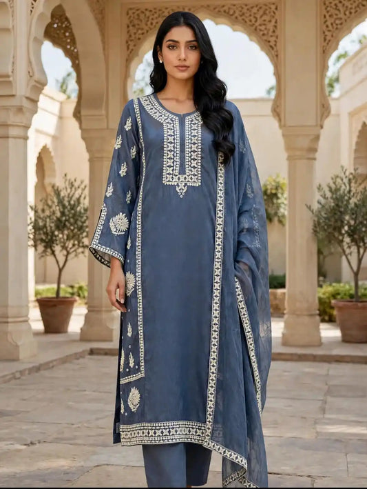  Slate Blue Embroidered Designer Suit Set  featuring a slate blue kurta with elegant white floral thread embroidery, matching straight pants, and a coordinating dupatta with a decorative white embroidered border.