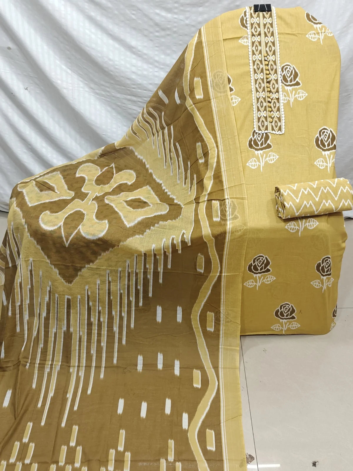 Mustard Rose Print Cotton Unstitched Suit with Lace Placket, Zigzag Bottom & Ikat Dupatta
