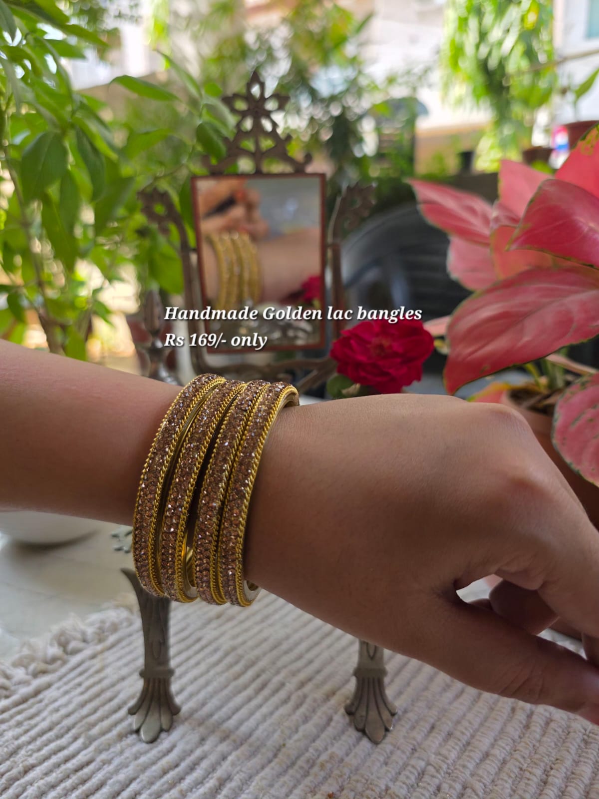 Handmade golden lac bangles on the wrist
