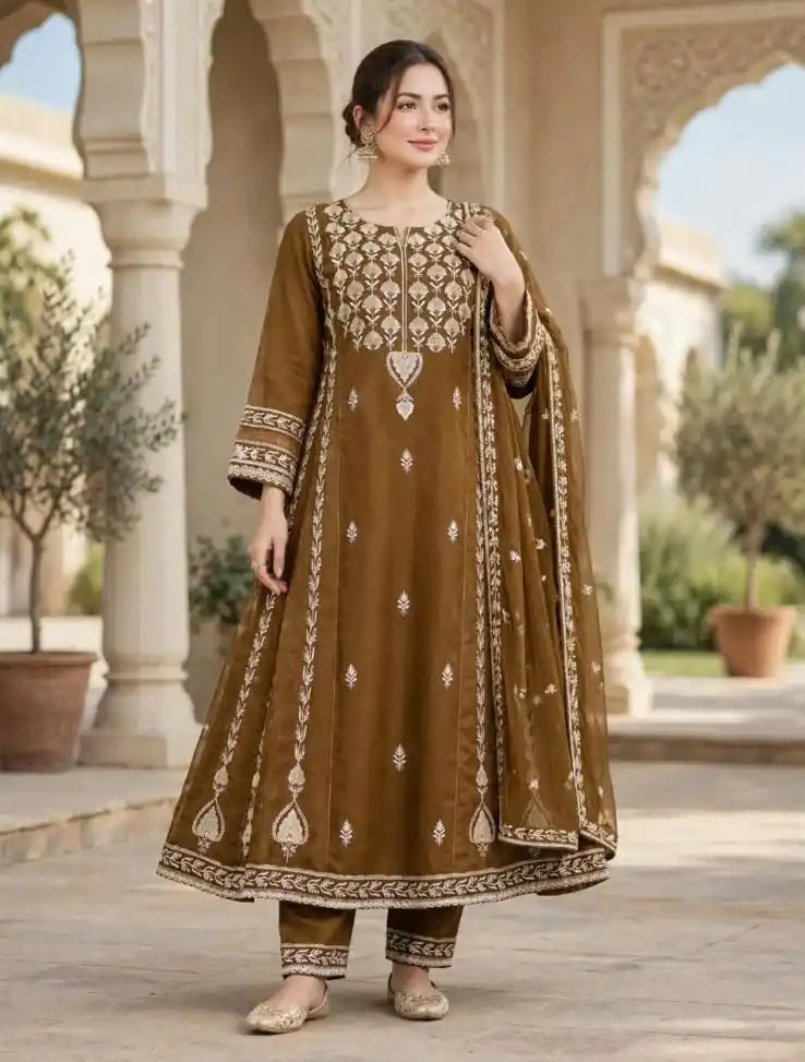 Woman wearing brown flared Anarkali suit with ivory embroidery, matching pants and embroidered dupatta