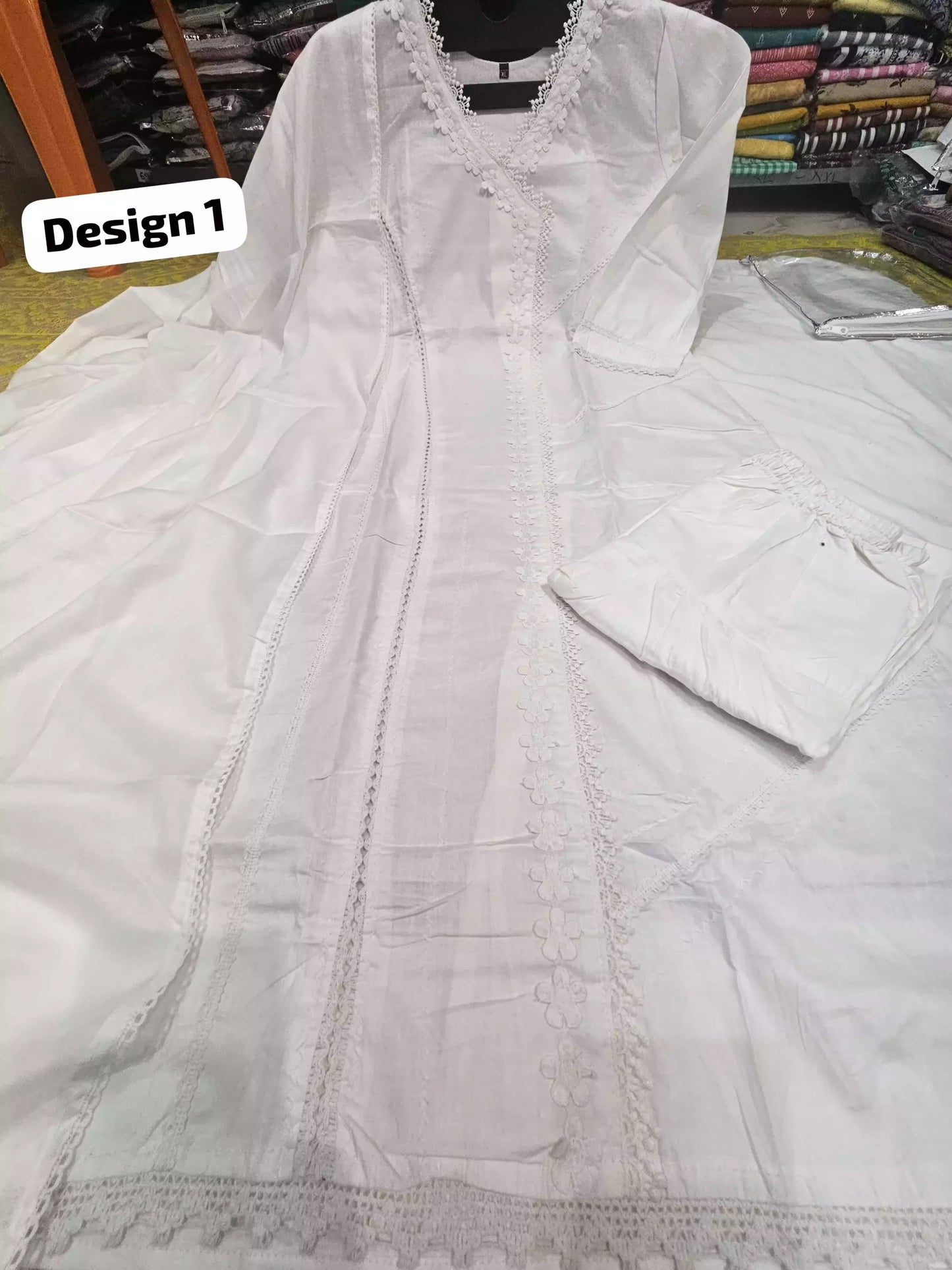 Hajj umrah white suit with embroidery shown in Design 1 featuring a white kurta and matching salwar.